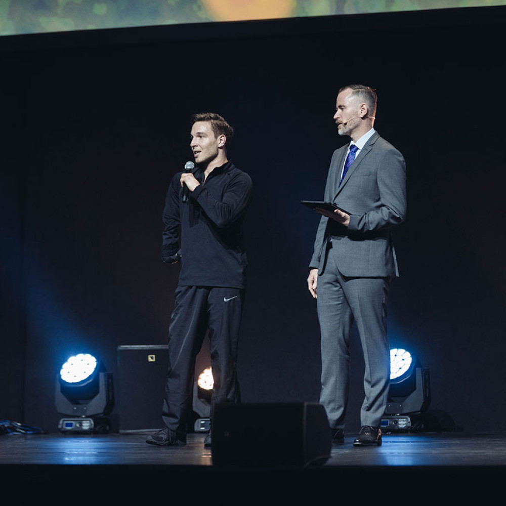 Two men standing on stage