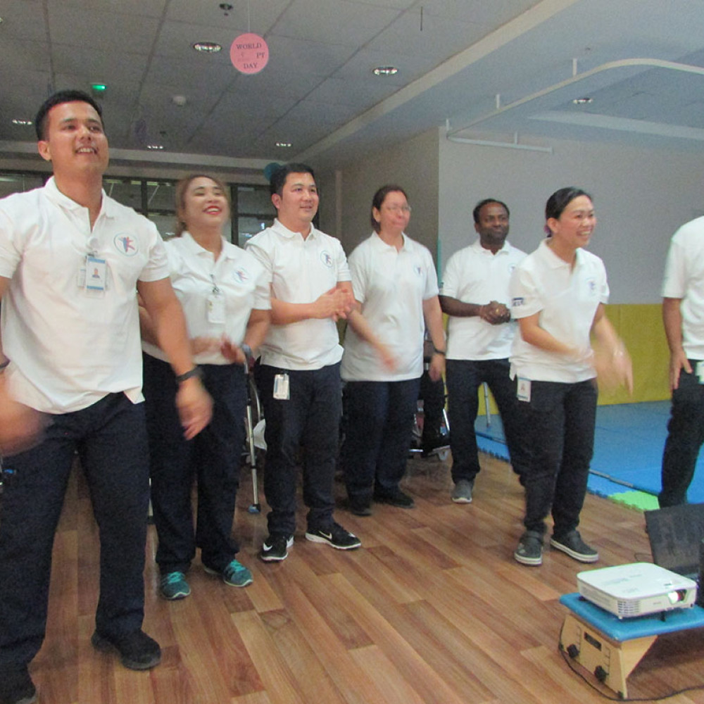 Photograph showing a celebration held in the United Arab Emirates to mark World PT Day 2018