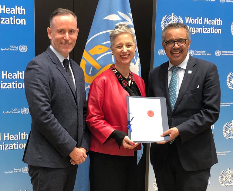 Jonathon Kruger and Emma Stokes with Tedros Adhanom Ghebreyesus, WHO Director-General